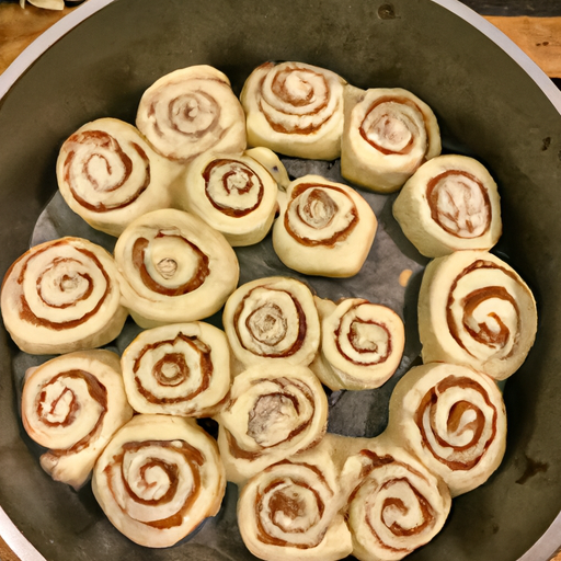 Sliced cinnamon rolls ready to be arranged in the Dutch oven.